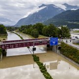 The Rhone River is overflowing the A9 motorway following the storms that caused major flooding, in Sierre, Switzerland, Sunday, June 30, 2024. (KEYSTONE/Jean-Christophe Bott)